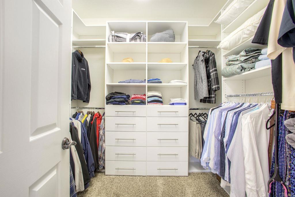 31220 Aquaduct Road Bonsall, CA 92003 - Photo 20 of 36 a view of walk in closet with clothes and shoes