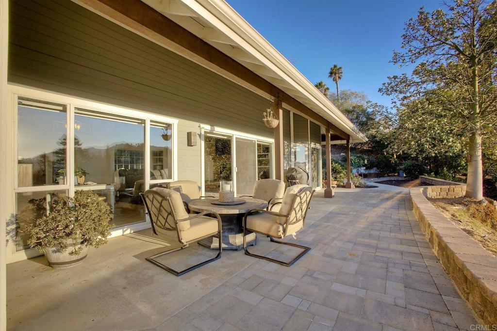 31220 Aquaduct Road Bonsall, CA 92003 - Photo 29 of 36 a building outdoor space with patio furniture and potted plants