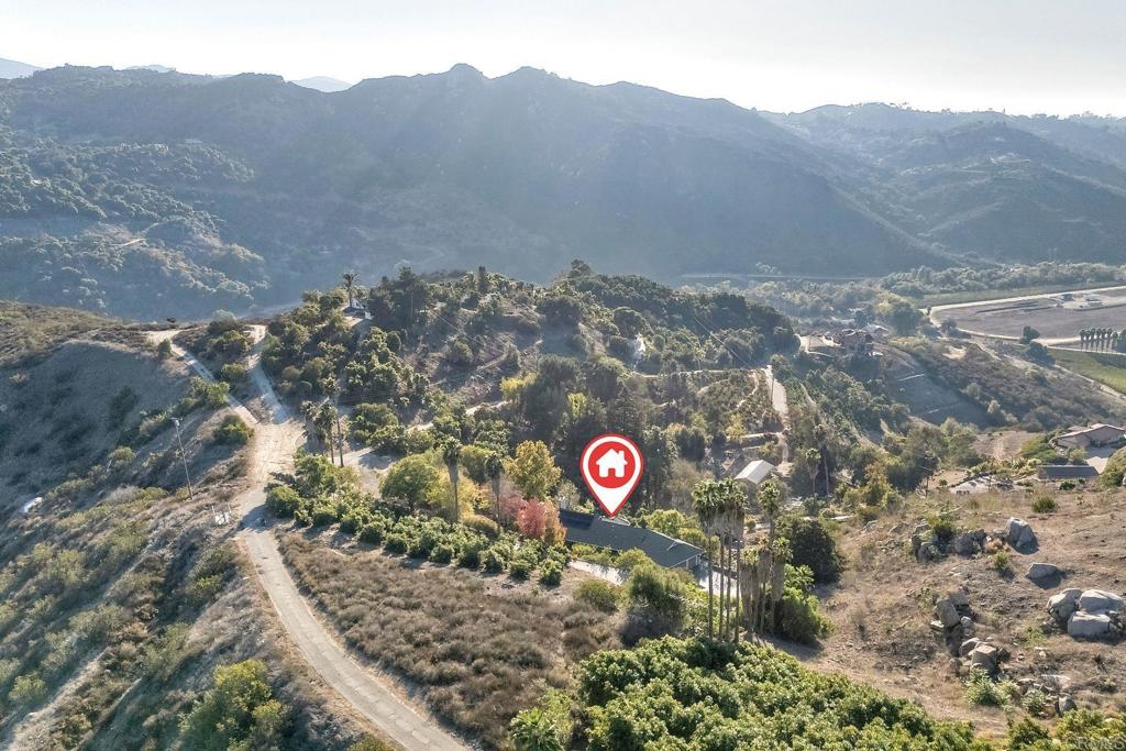 31220 Aquaduct Road Bonsall, CA 92003 - Photo 36 of 36 a view of a area with mountains and a couple of flower