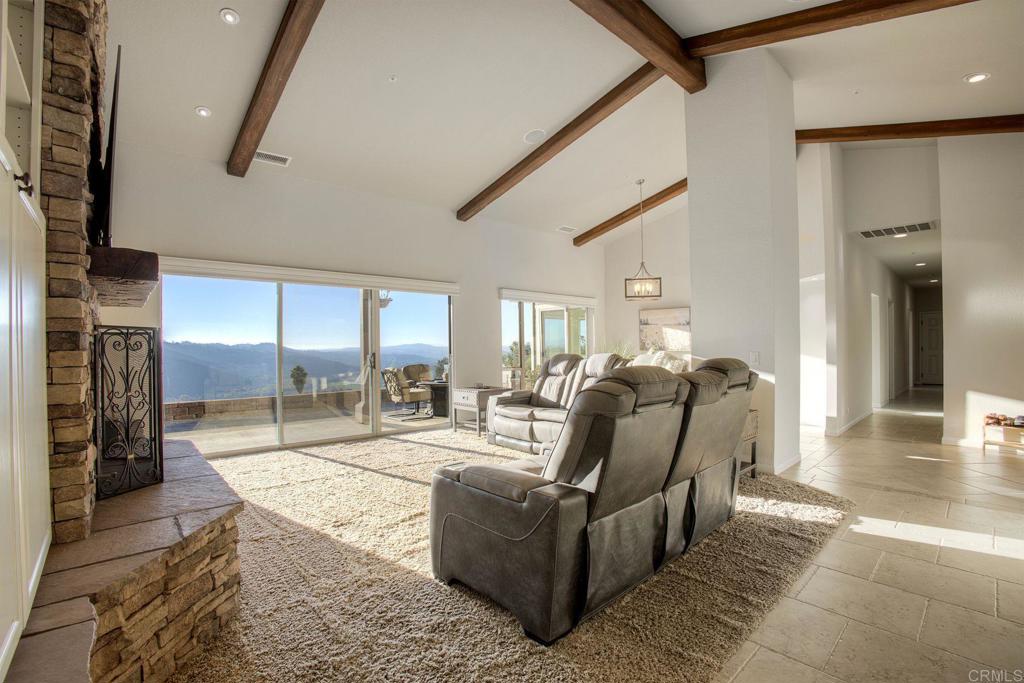 31220 Aquaduct Road Bonsall, CA 92003 - Photo 7 of 36 a living room with furniture and a wooden floor