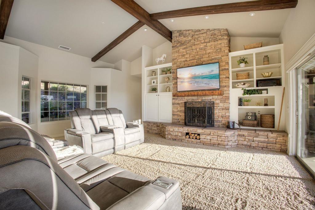 31220 Aquaduct Road Bonsall, CA 92003 - Photo 9 of 36 a living room with furniture and a fireplace
