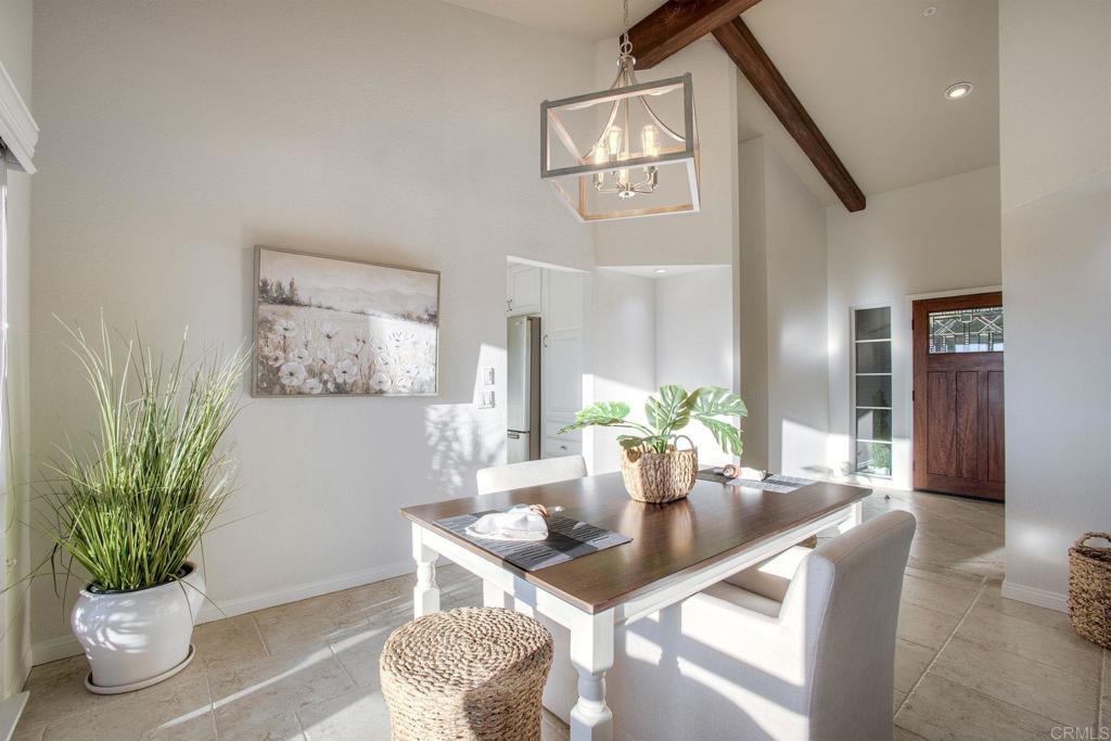 31220 Aquaduct Road Bonsall, CA 92003 - Photo 10 of 36 a dining room with furniture and wooden floor