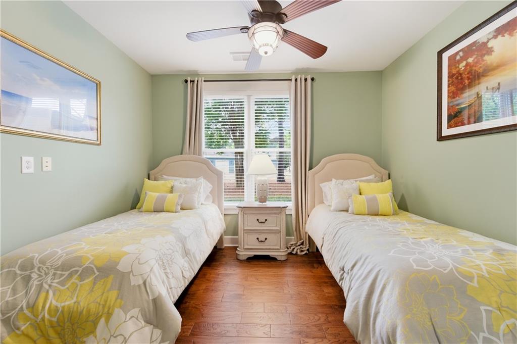 117 South Bay Road, Unit 402 Eatonton, GA 31024 - Photo 16 of 48 a bedroom with a bed and a large window