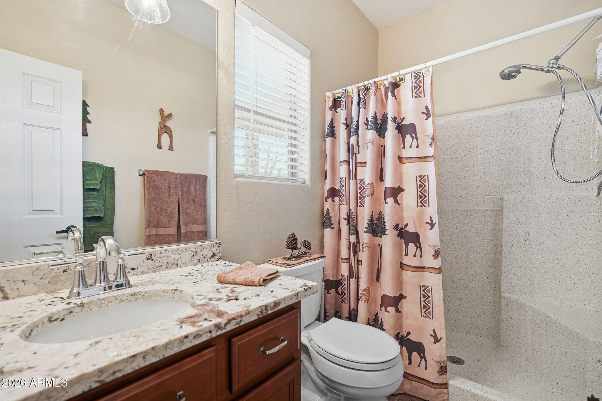 2101 South Meridian Road, Unit 164 Apache Junction, AZ 85120 - Photo 11 of 29 a bathroom with a granite countertop sink toilet and shower