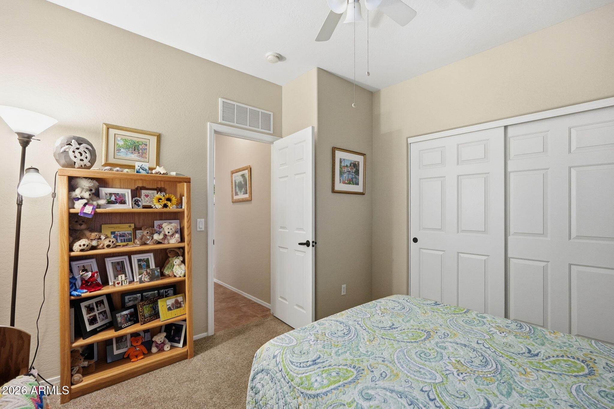 2101 South Meridian Road, Unit 164 Apache Junction, AZ 85120 - Photo 12 of 29 a bedroom with a bed and a book shelf