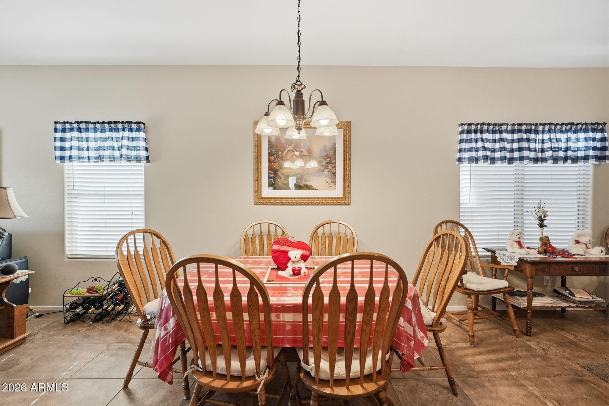 2101 South Meridian Road, Unit 164 Apache Junction, AZ 85120 - Photo 4 of 29 a dining room with furniture a window and a chandelier