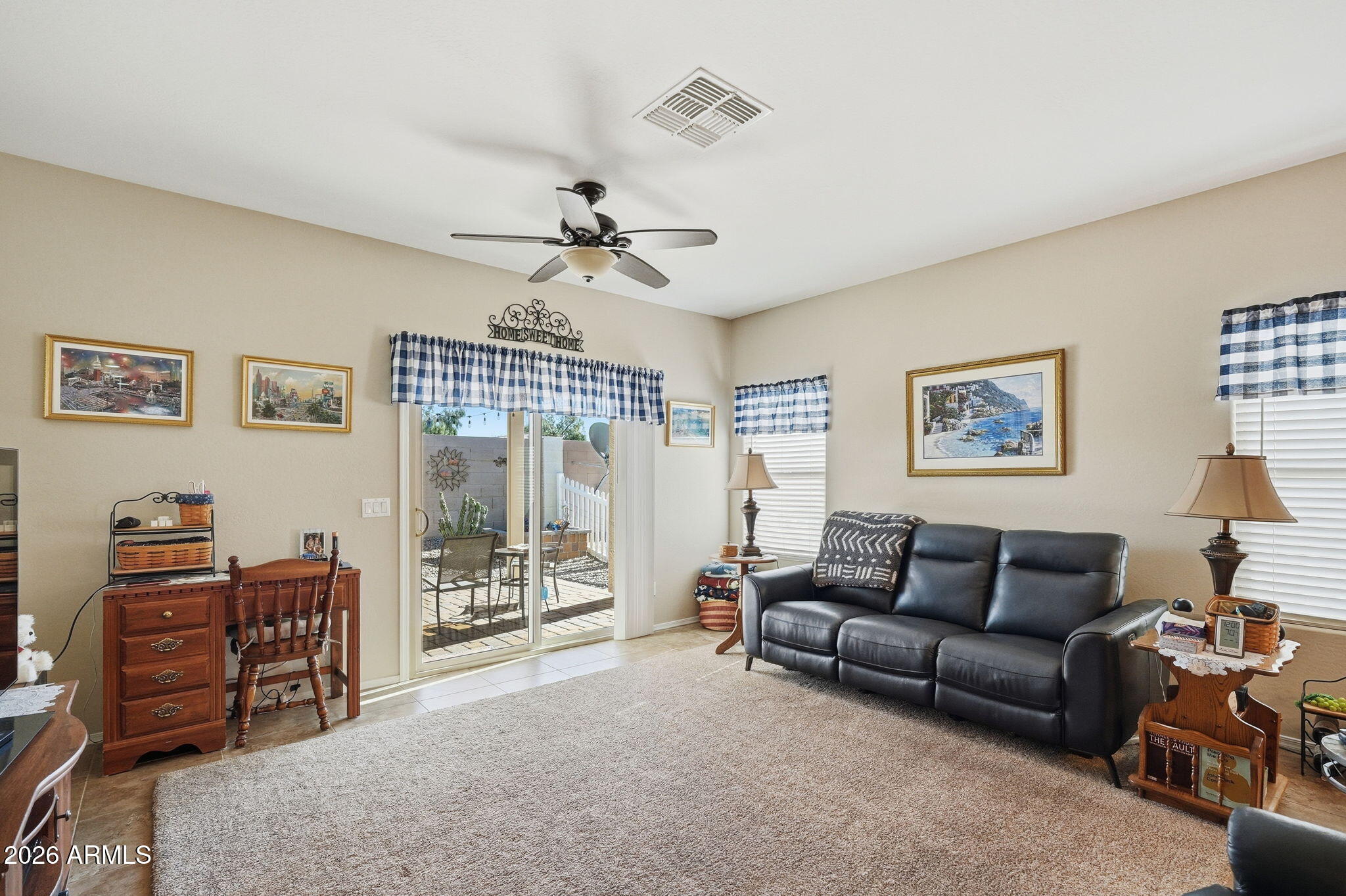 2101 South Meridian Road, Unit 164 Apache Junction, AZ 85120 - Photo 7 of 29 a living room with furniture a ceiling fan and a window