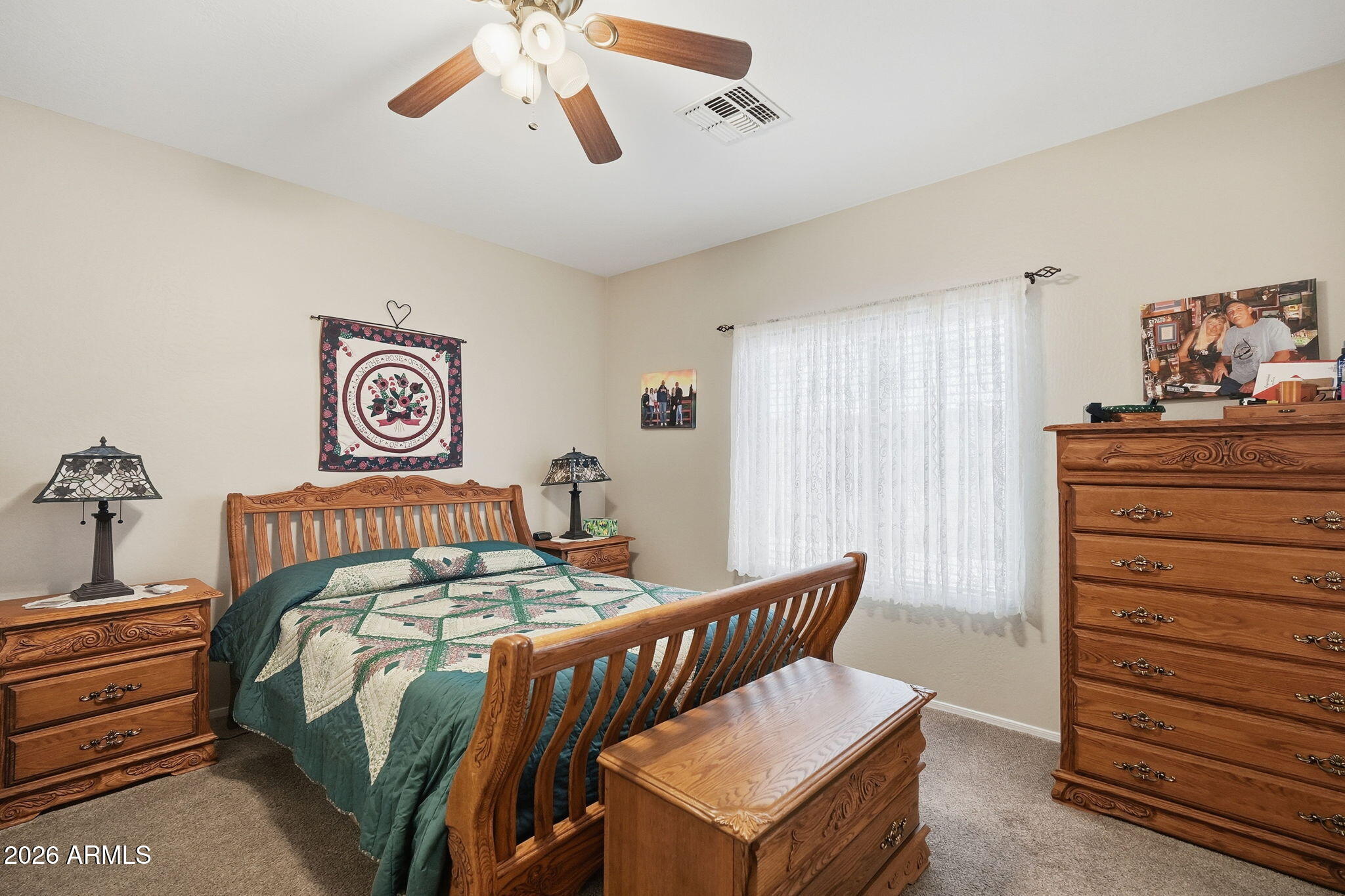 2101 South Meridian Road, Unit 164 Apache Junction, AZ 85120 - Photo 9 of 29 a bedroom with a bed and a dresser in it
