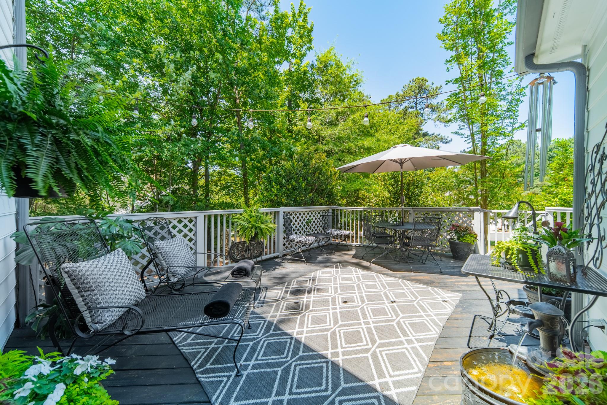 11043 Seven Coves Drive Tega Cay, SC 29708 - Photo 9 of 45 a view of a chair and tables in the patio