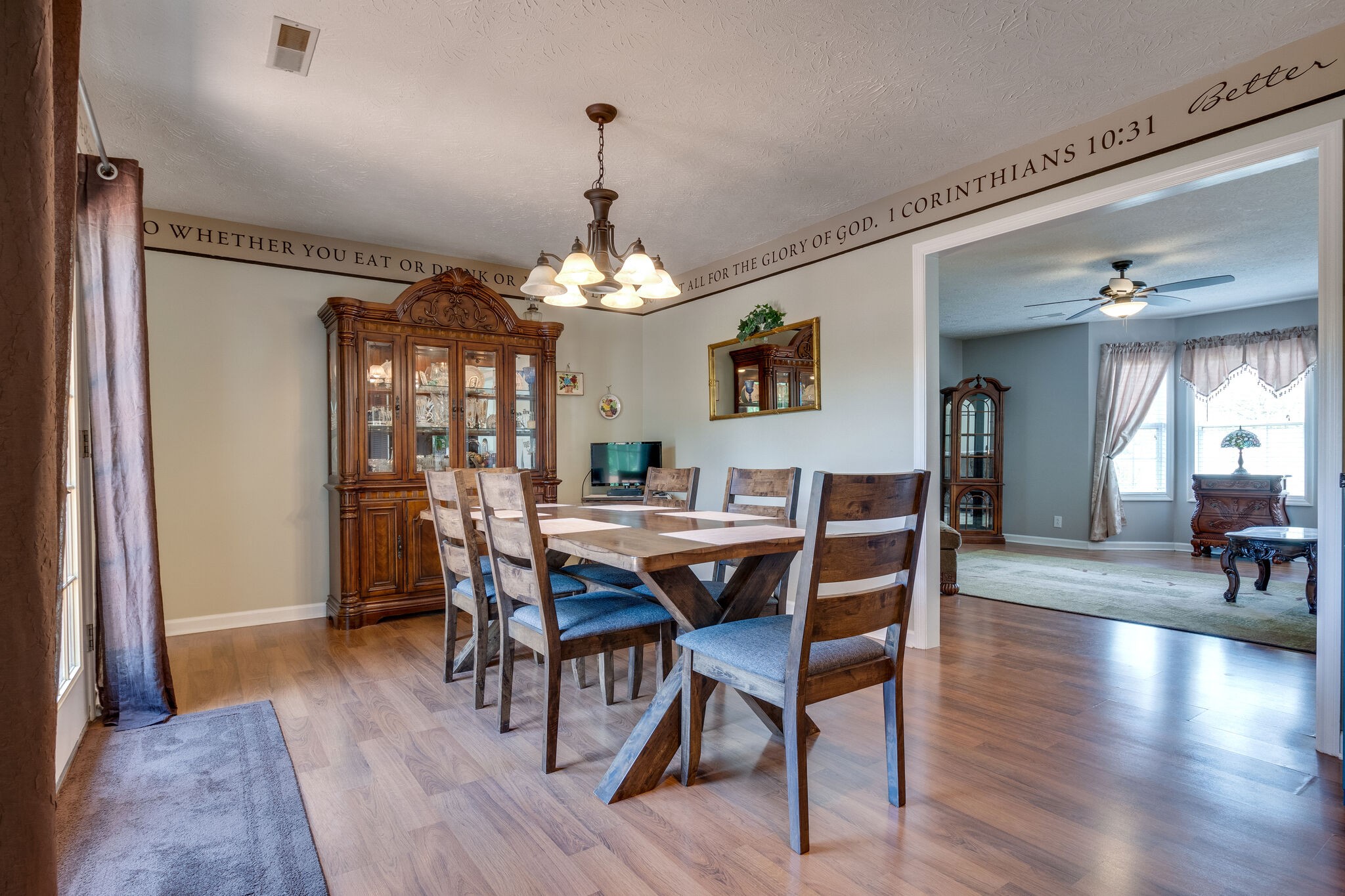 2143 Lee Road Spring Hill, TN 37174 - Photo 11 of 25 a view of a dining room with furniture and wooden floor