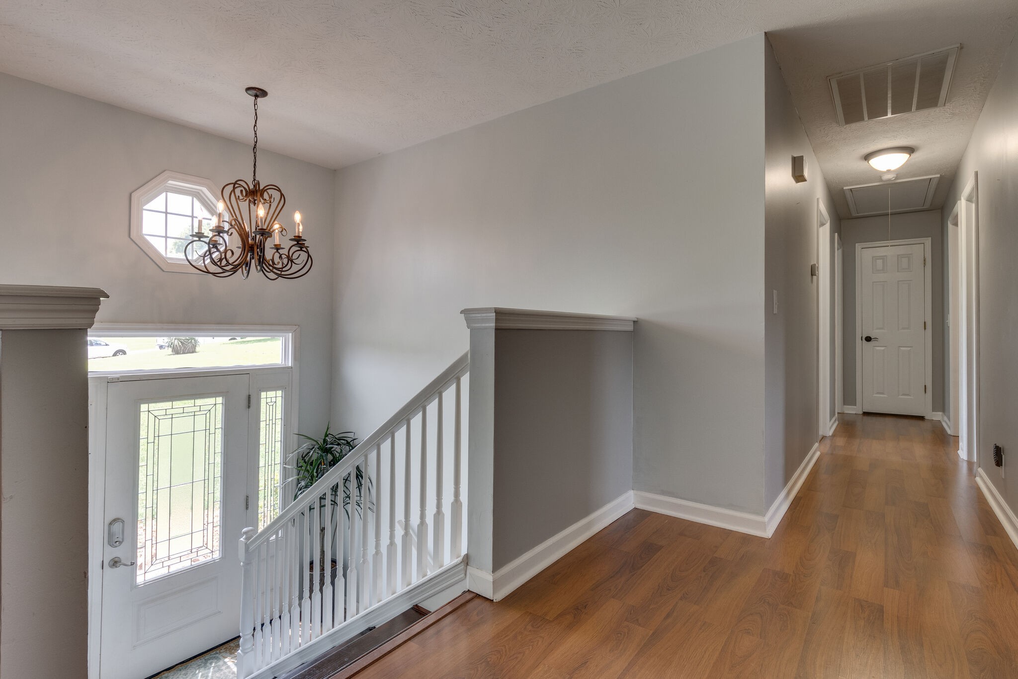 2143 Lee Road Spring Hill, TN 37174 - Photo 5 of 25 a view of a hallway with wooden floor and staircase