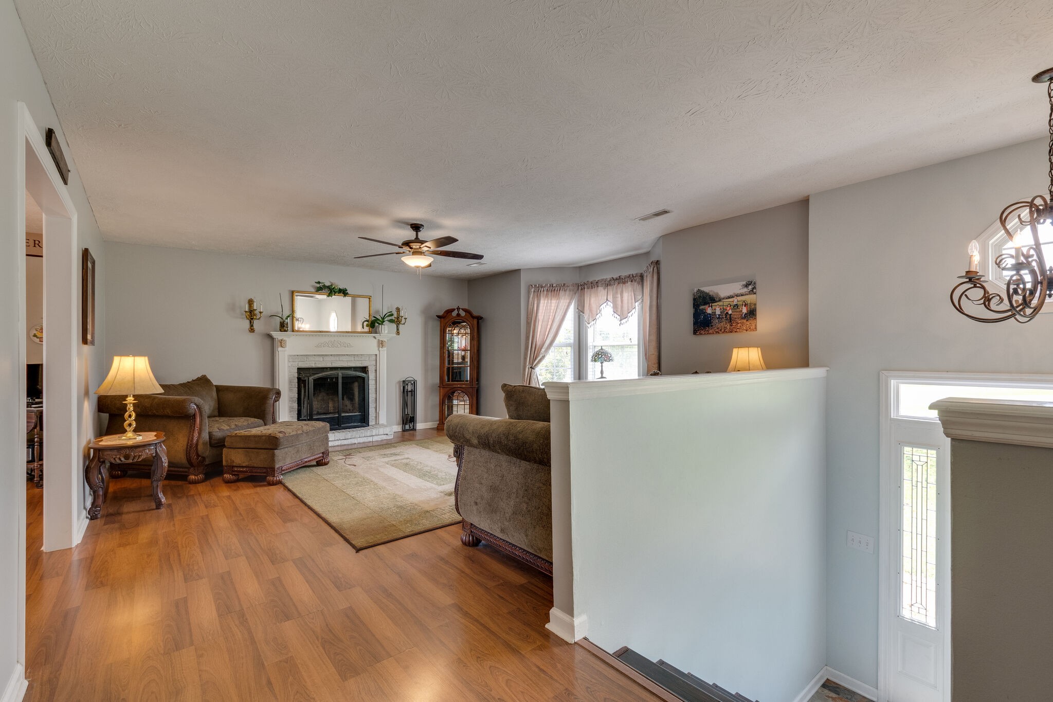 2143 Lee Road Spring Hill, TN 37174 - Photo 6 of 25 a living room with furniture and a fireplace
