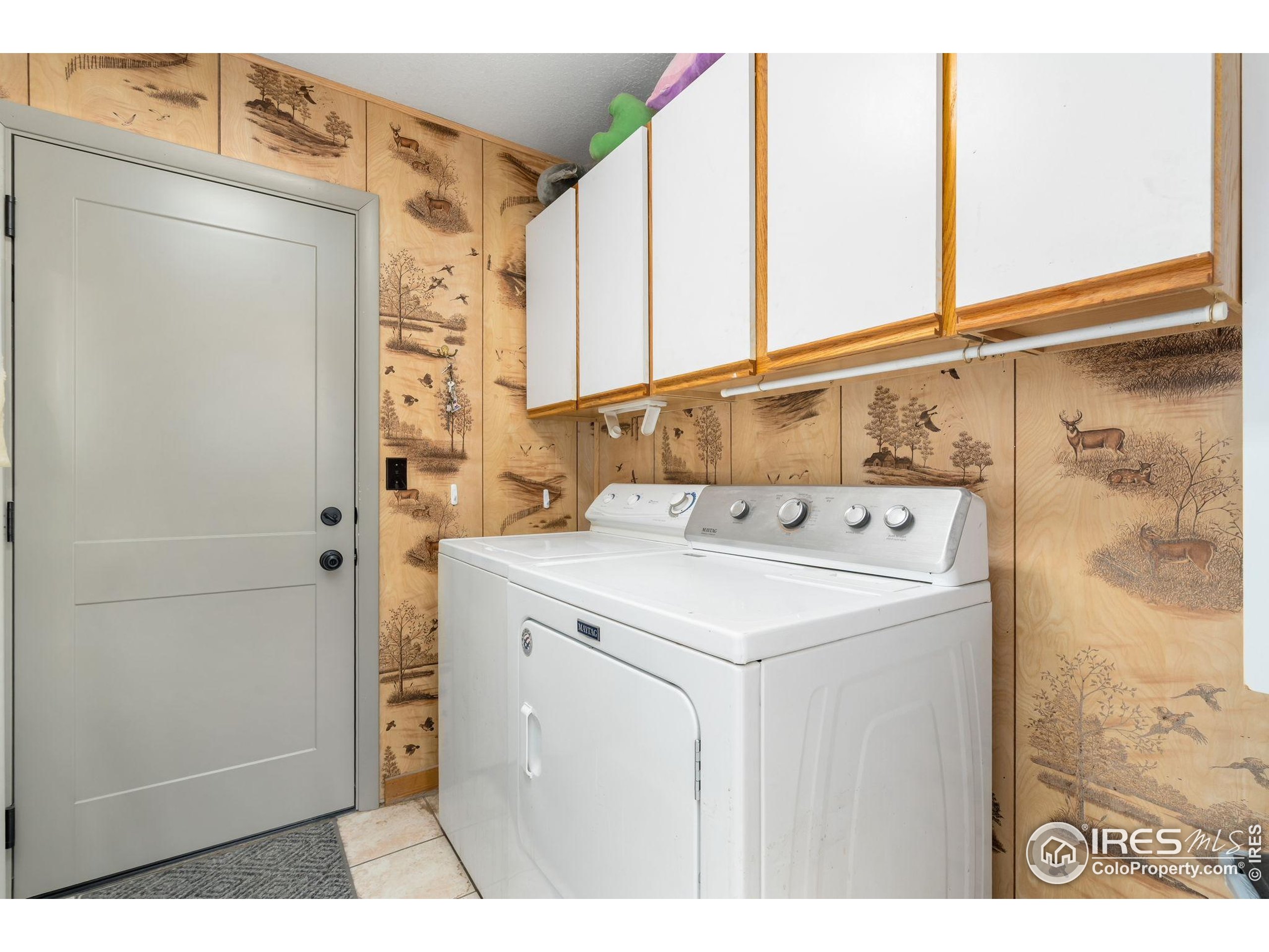 141 Tami Road Red Feather Lakes, CO 80545 - Photo 11 of 49 a utility room with dryer and washer