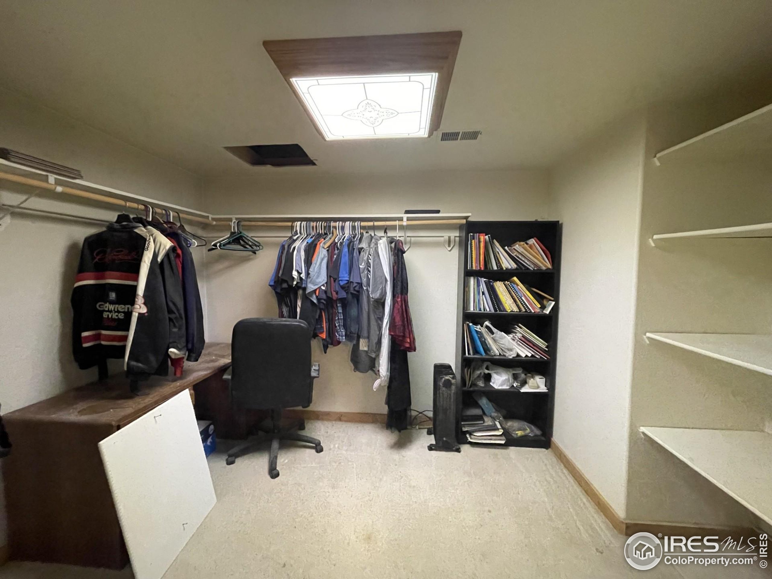 141 Tami Road Red Feather Lakes, CO 80545 - Photo 22 of 49 a view of walk in closet with clothes and shoes