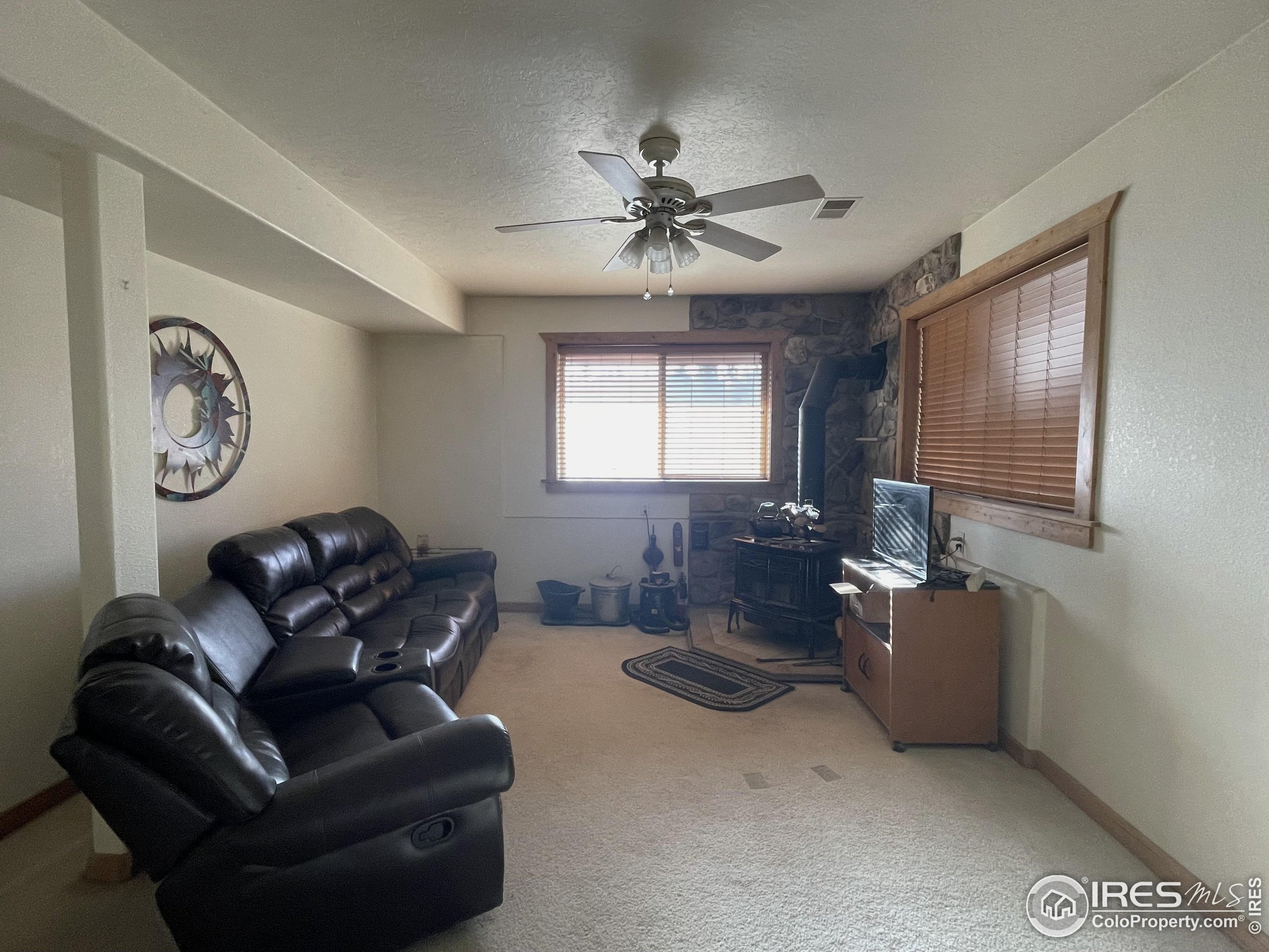 141 Tami Road Red Feather Lakes, CO 80545 - Photo 25 of 49 a living room with furniture and a window