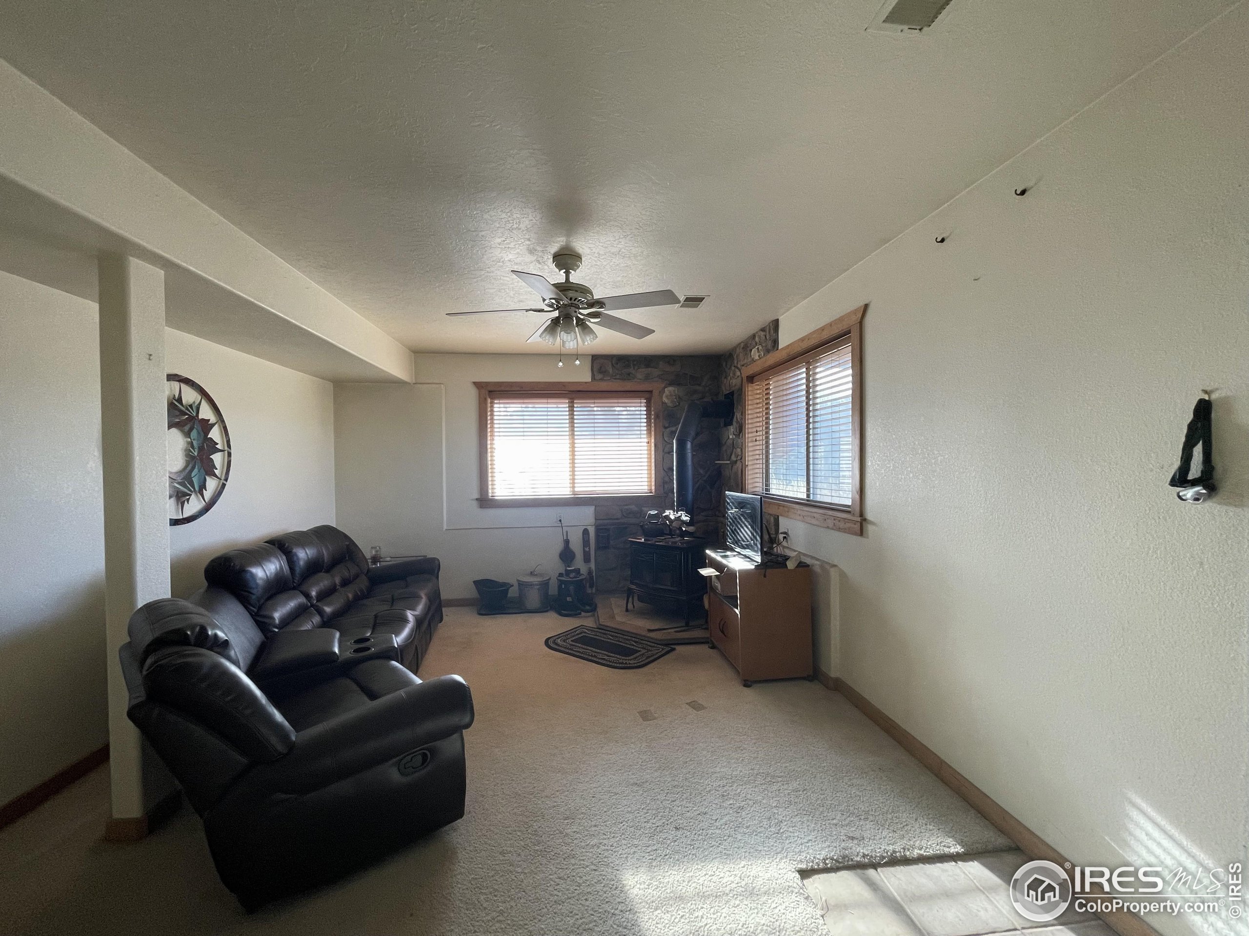 141 Tami Road Red Feather Lakes, CO 80545 - Photo 26 of 49 a living room with furniture and a window