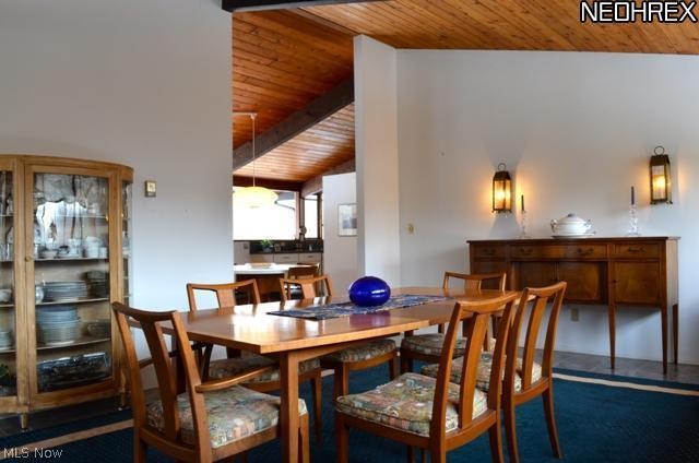 Dining room opens to kitchen and large screened porch.