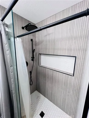 a bathroom with a sink and shower