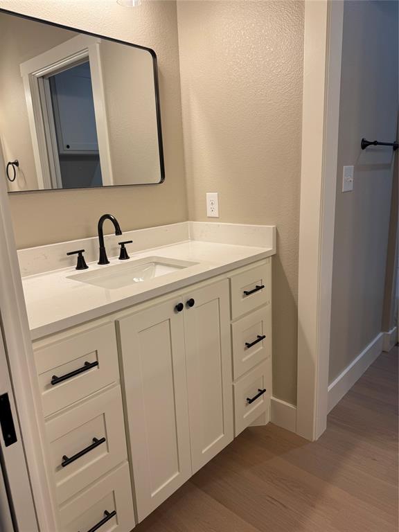 143 Ridge Road Tuscola, TX 79562 - Photo 22 of 24 a bathroom with a sink and a mirror