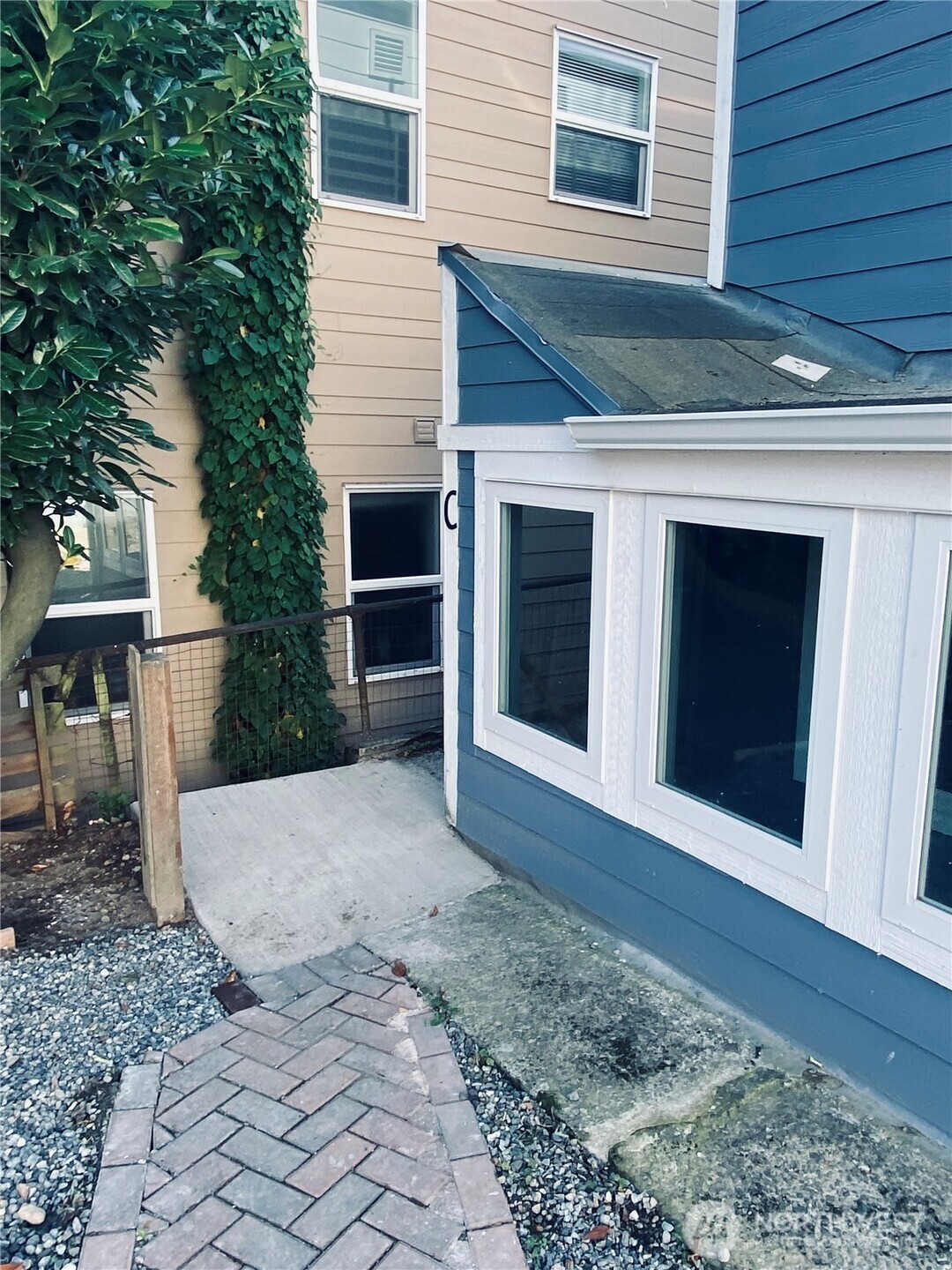 3405 Rockefeller Avenue, Unit C Everett, WA 98201 - Photo 13 of 15 a front view of a house with a yard
