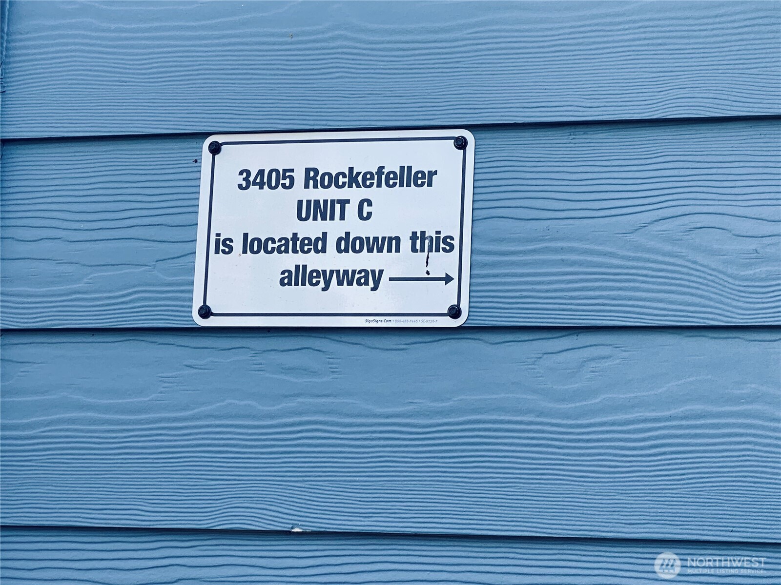 3405 Rockefeller Avenue, Unit C Everett, WA 98201 - Photo 15 of 15 a sign on a brick wall