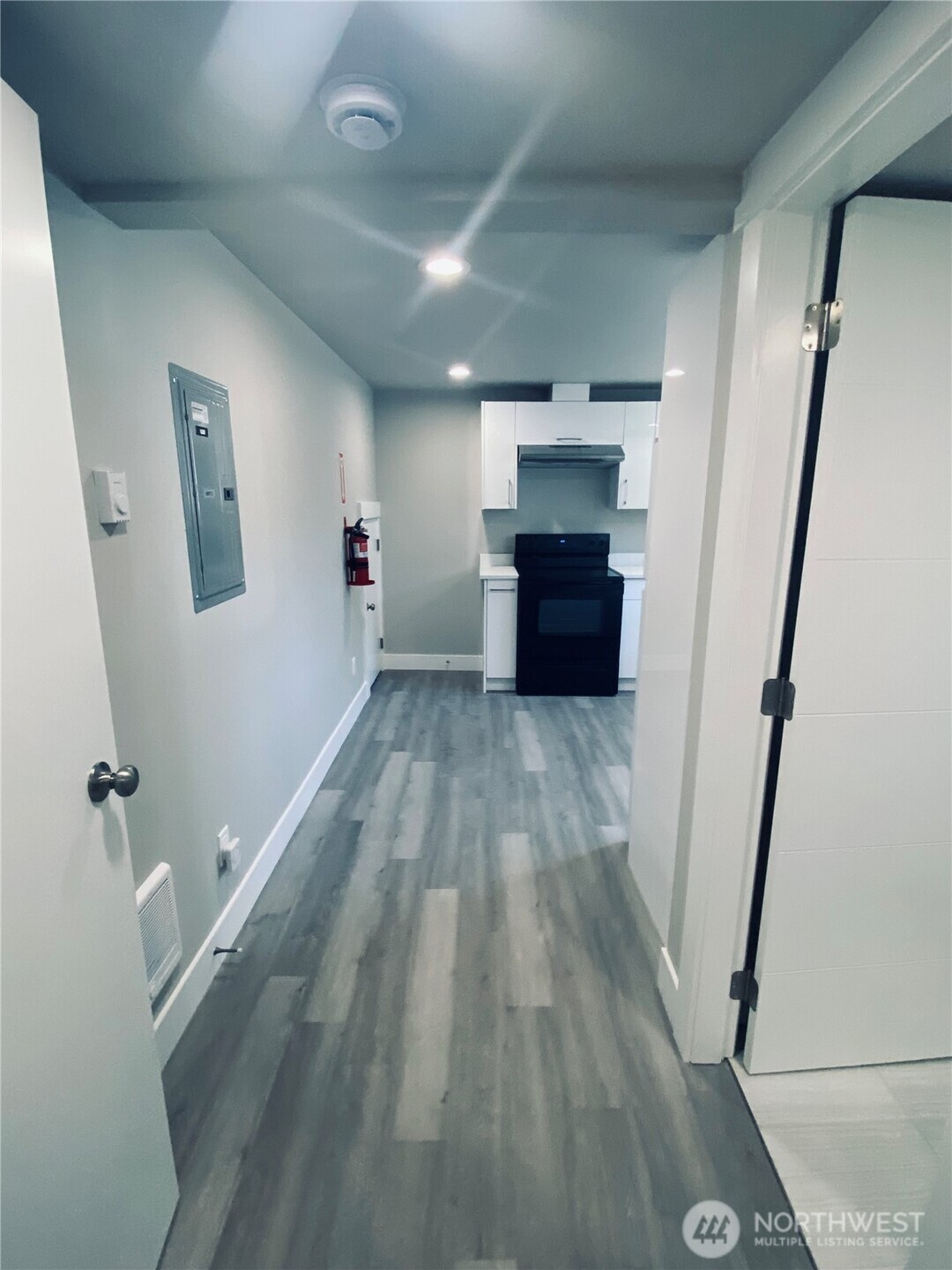 3405 Rockefeller Avenue, Unit C Everett, WA 98201 - Photo 6 of 15 wooden floor in a hall with an empty room