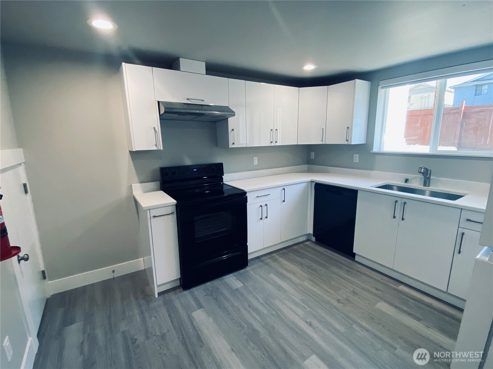 3405 Rockefeller Avenue, Unit C Everett, WA 98201 - Photo 8 of 15 a kitchen with a sink a window and cabinets