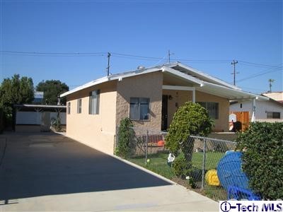907 Mariposa Street Glendale, CA 91205 - Photo 1 of 1 a front view of a house with garden