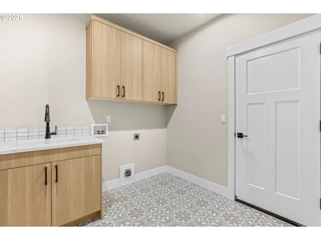 a kitchen with a sink and cabinets
