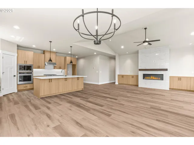 a view of kitchen with cabinets and wooden floor
