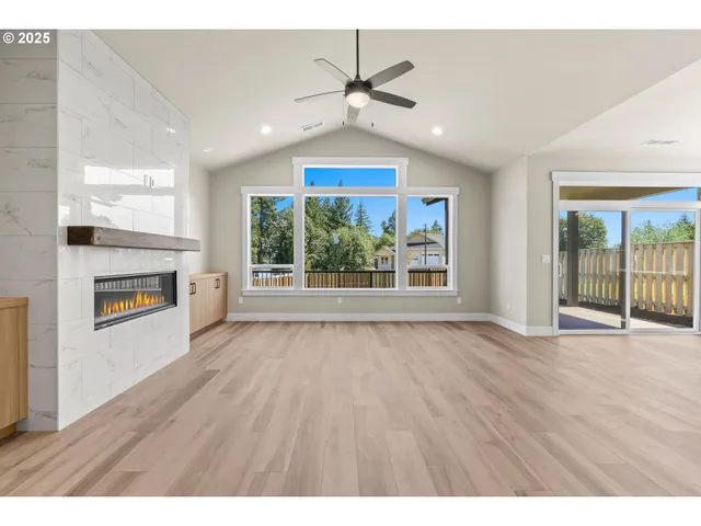 a view of livingroom and kitchen with wooden floor
