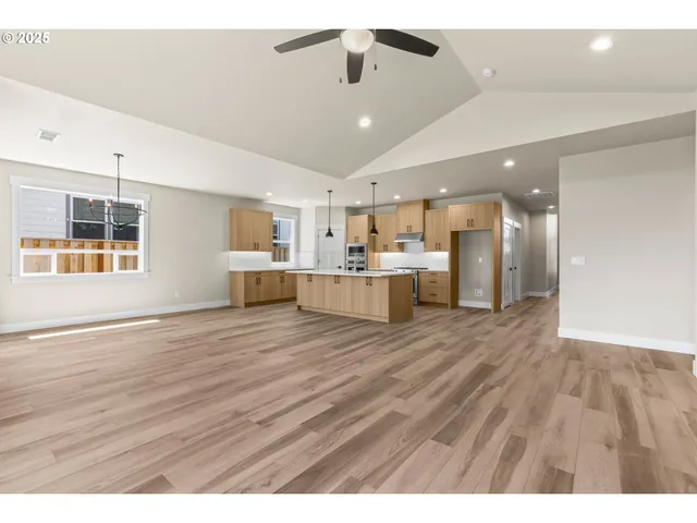 a view of kitchen and wooden floor