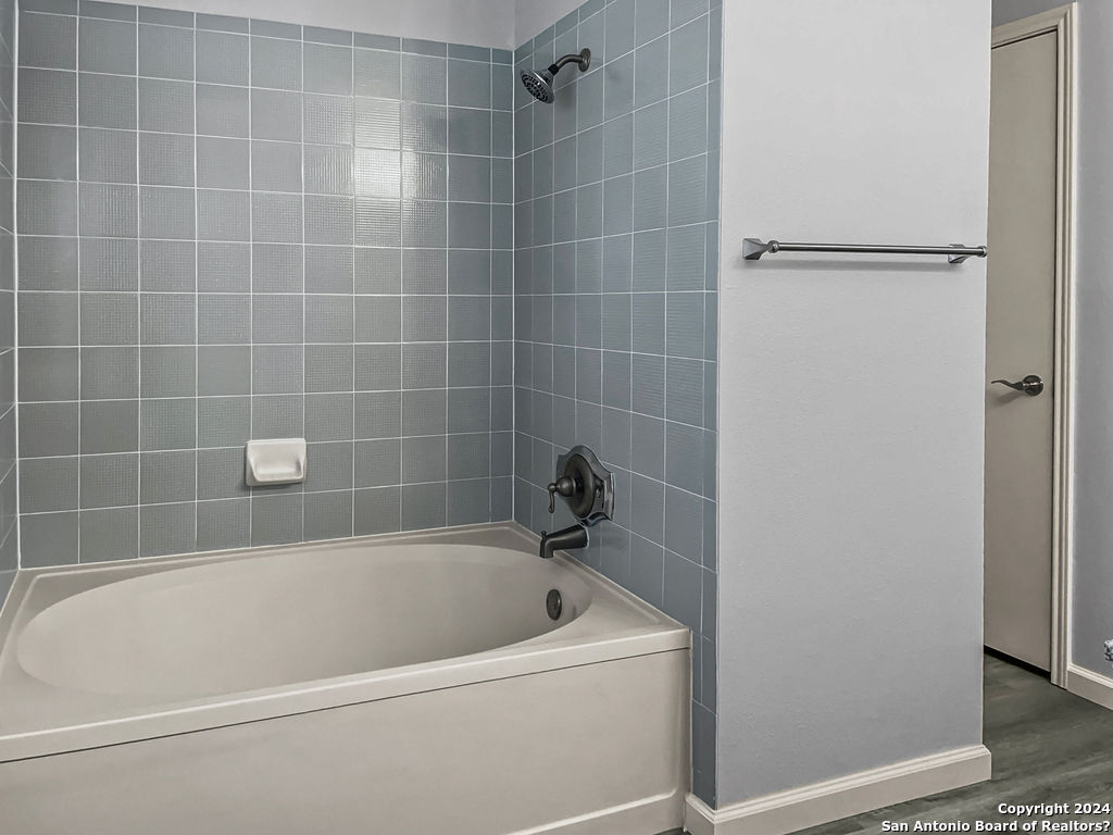 13211 Huntsman Road San Antonio, TX 78249 - Photo 16 of 33 a white bath tub and shower