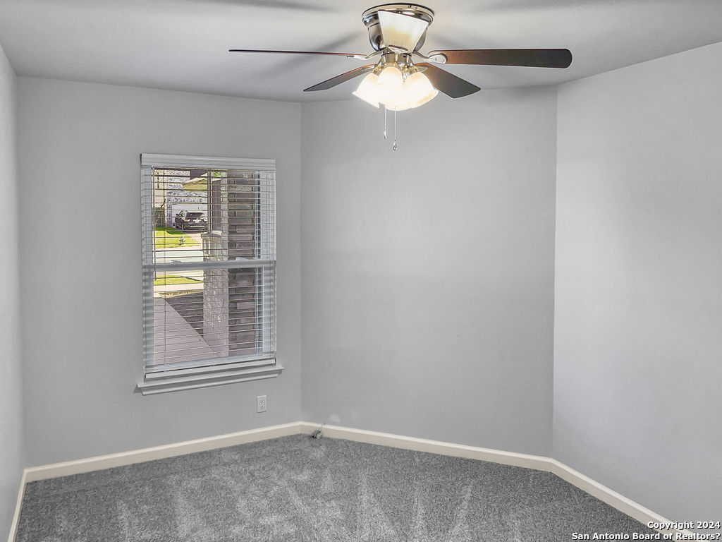 13211 Huntsman Road San Antonio, TX 78249 - Photo 25 of 33 an empty room with windows and fan