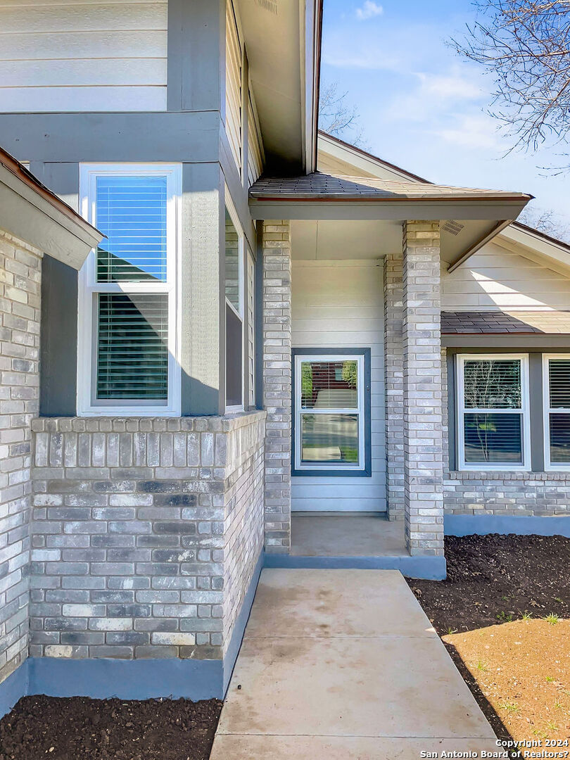 13211 Huntsman Road San Antonio, TX 78249 - Photo 4 of 33 a view of front door of house