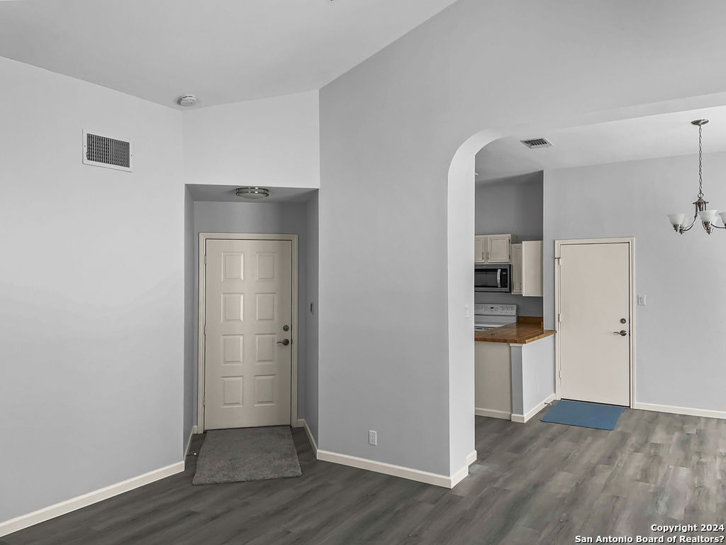 13211 Huntsman Road San Antonio, TX 78249 - Photo 7 of 33 a view of empty room with wooden floor