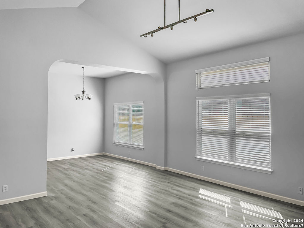 13211 Huntsman Road San Antonio, TX 78249 - Photo 9 of 33 a view of empty room with wooden floor and fan