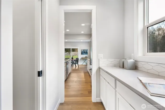 a large kitchen with kitchen island a large counter top space