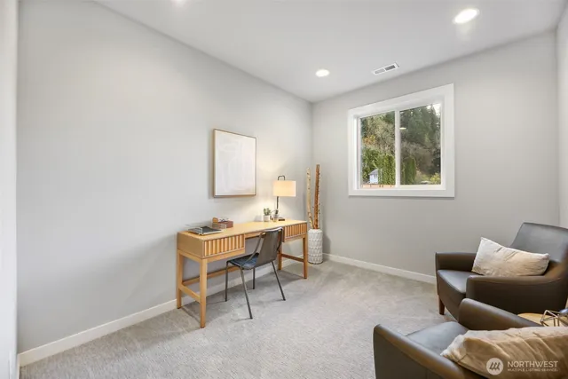 a bathroom with a granite countertop sink a toilet and shower