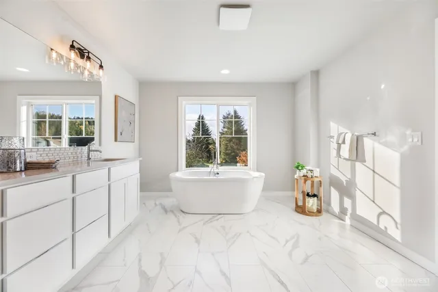 a bathroom with a bathtub and a shower