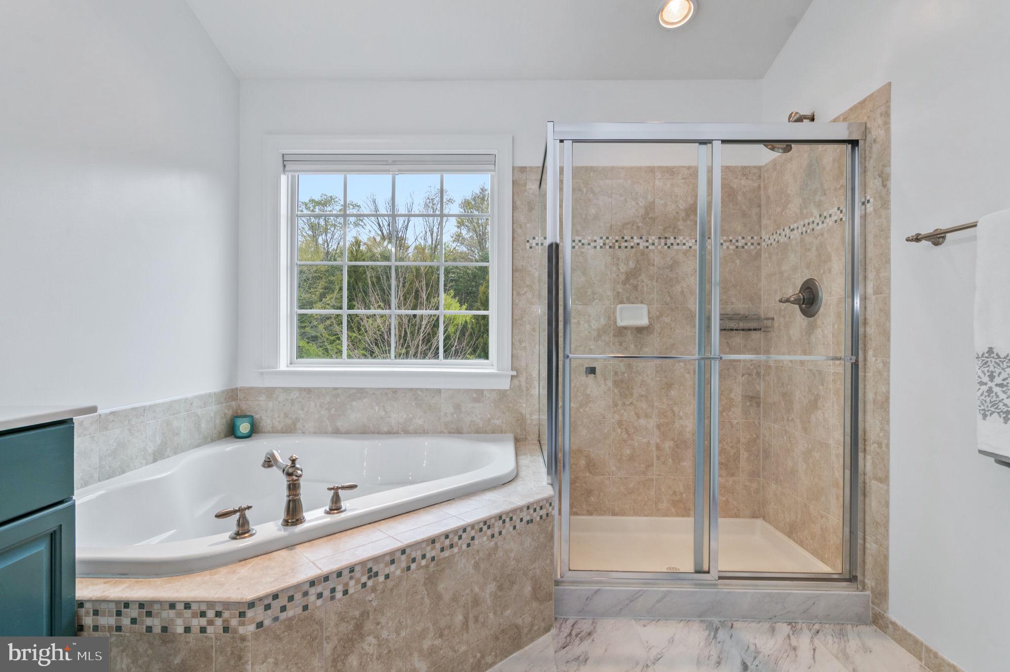 5893 Riverside Drive Woodbridge, VA 22193 - Photo 17 of 36 a white bath tub sitting next to a shower
