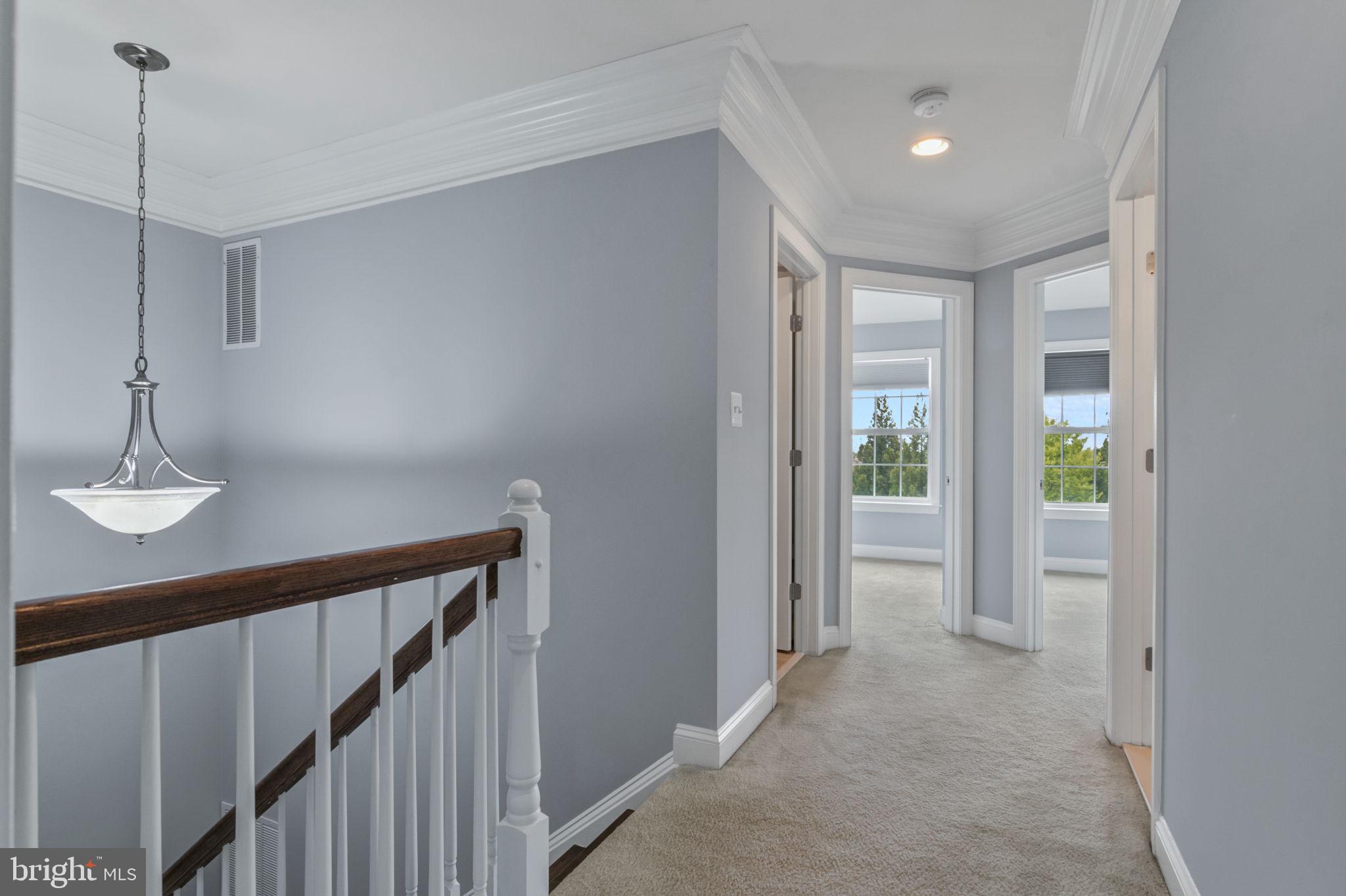 5893 Riverside Drive Woodbridge, VA 22193 - Photo 20 of 36 a view of a hallway with bathroom and wooden floor