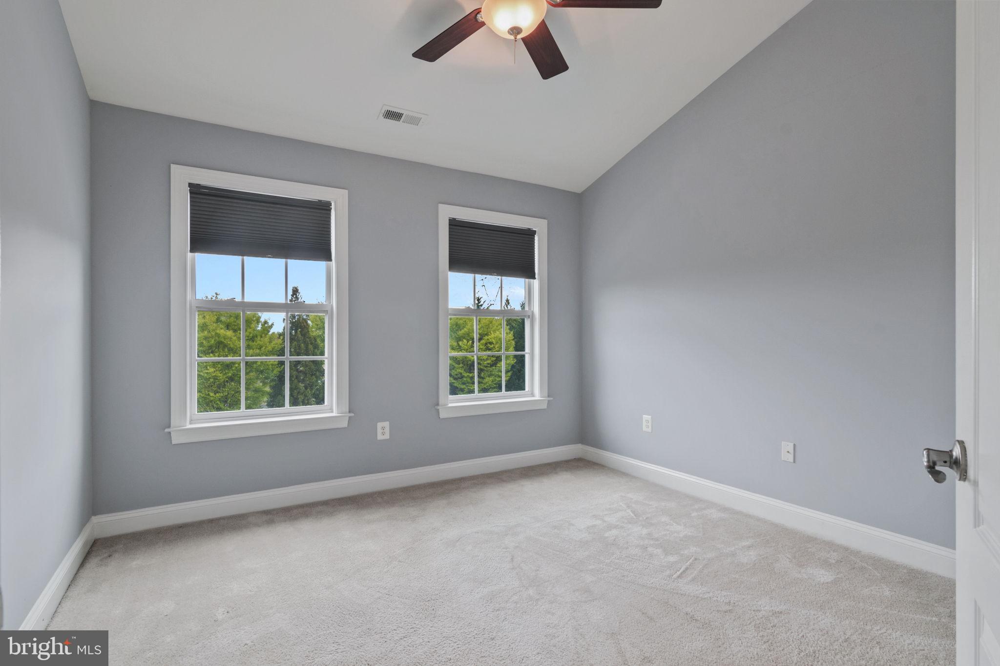 5893 Riverside Drive Woodbridge, VA 22193 - Photo 22 of 36 an empty room with windows and fan