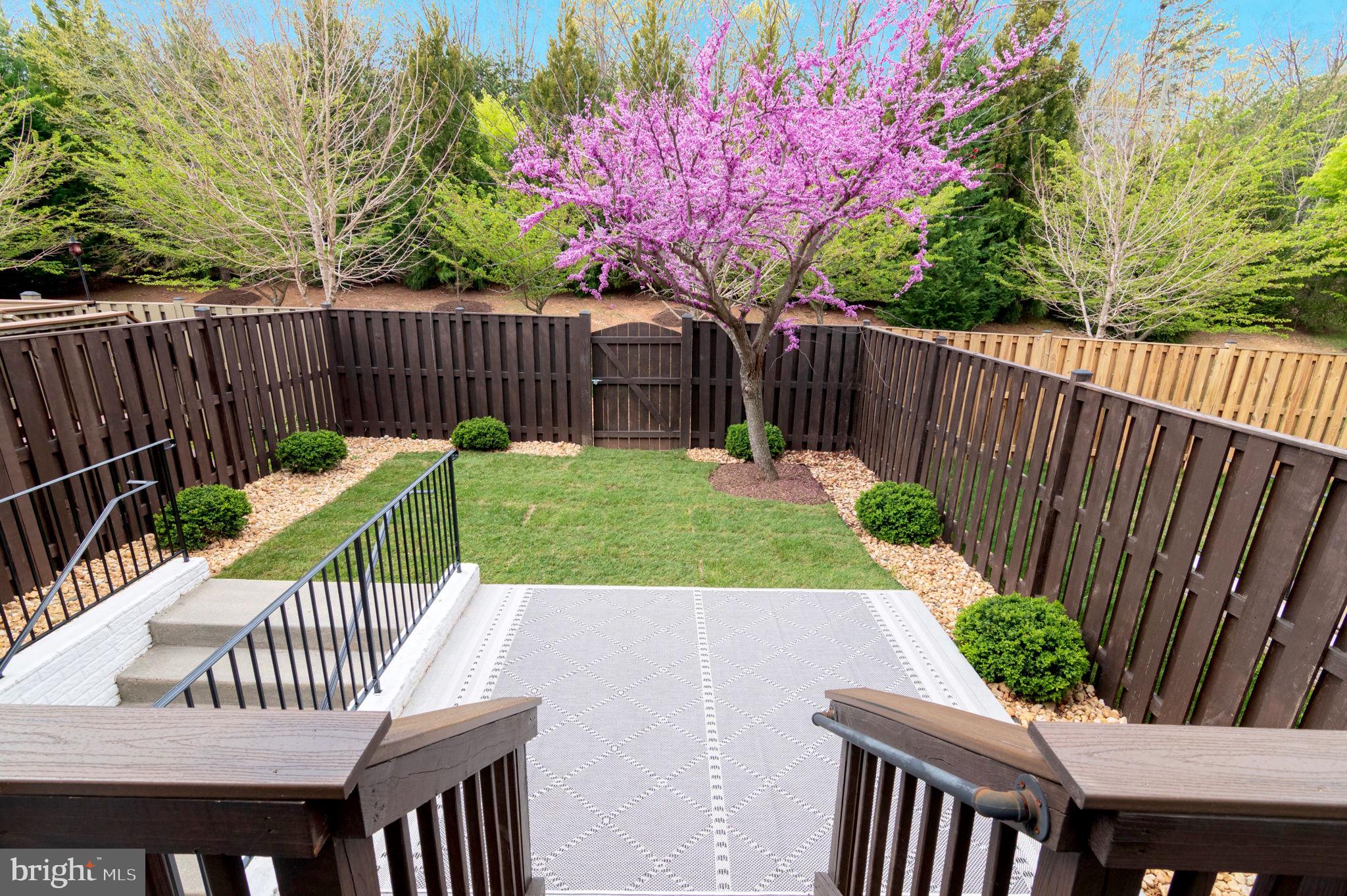 5893 Riverside Drive Woodbridge, VA 22193 - Photo 31 of 36 a view of a chairs and table in the patio with wooden fence