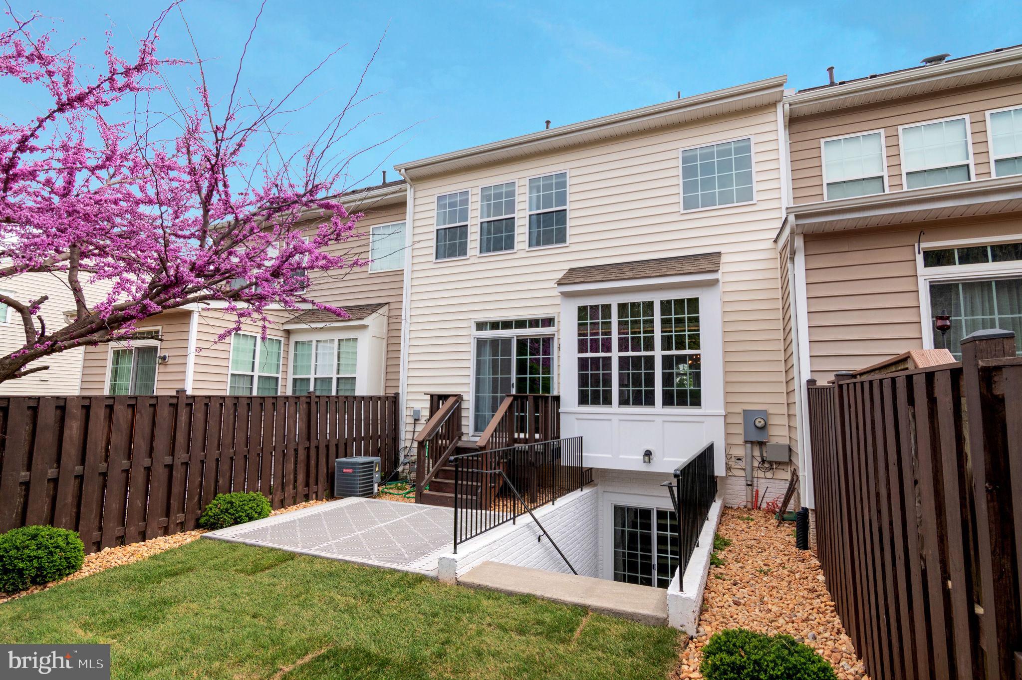 5893 Riverside Drive Woodbridge, VA 22193 - Photo 32 of 36 a front view of a house with a yard