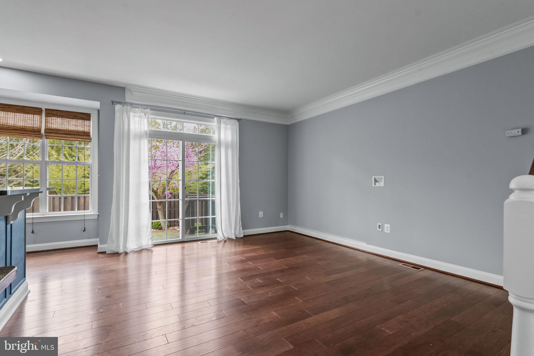 5893 Riverside Drive Woodbridge, VA 22193 - Photo 8 of 36 wooden floor in an empty room with a window