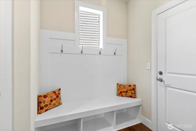 a room with white wall and window