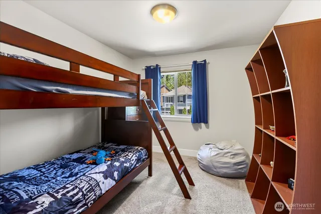 a bedroom with bed and a window