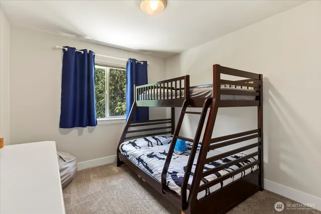 a bedroom with furniture and a window