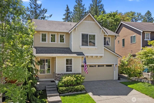 a view of house with a yard